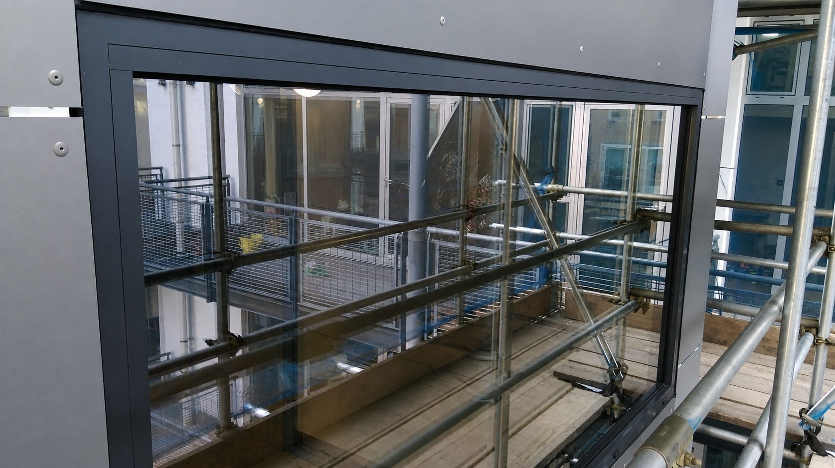 Close view of a new window unit fitted within Ability Plaza's re-clad elevation