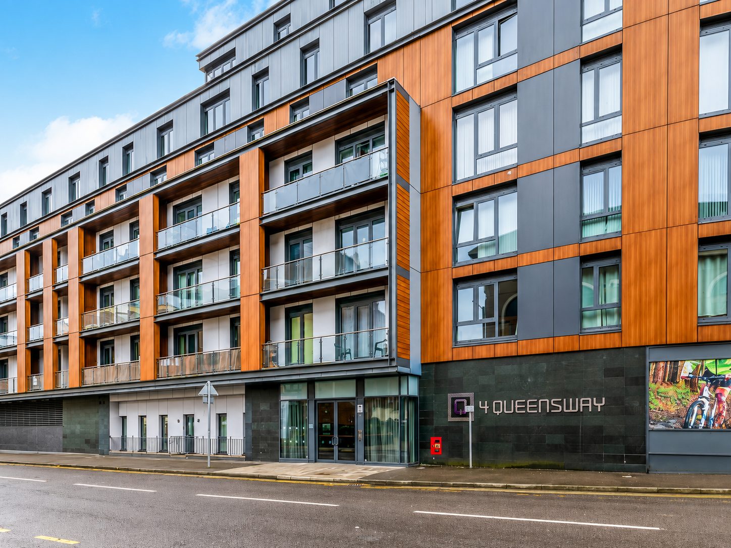 Orange timber-effect cladding at the '4 Queensway' entrance to Nobel House, Redhill