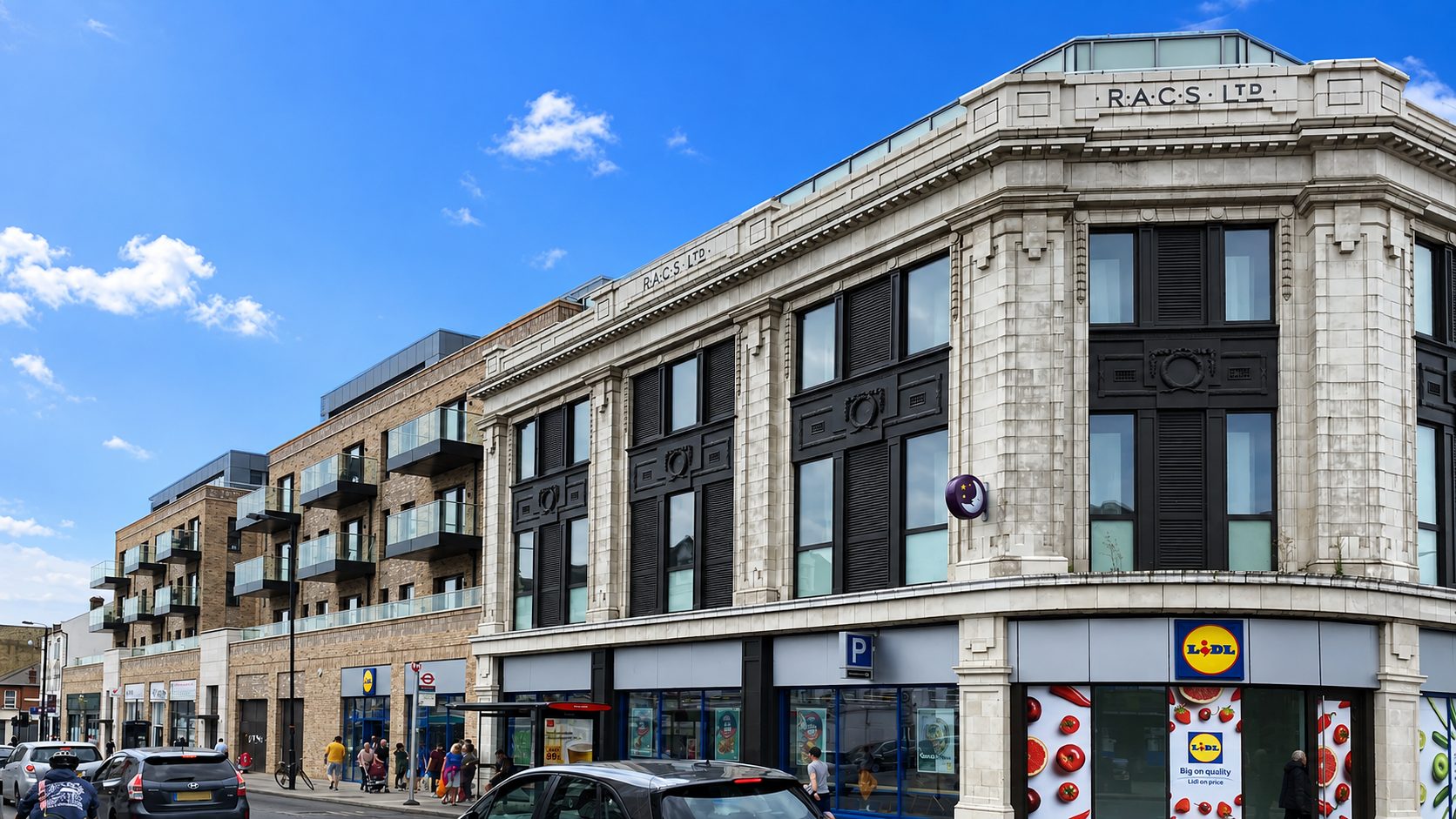 The restored RACS Ltd faience frontage on Upper Tooting Road, with the new brick apartment blocks behind it, Tooting