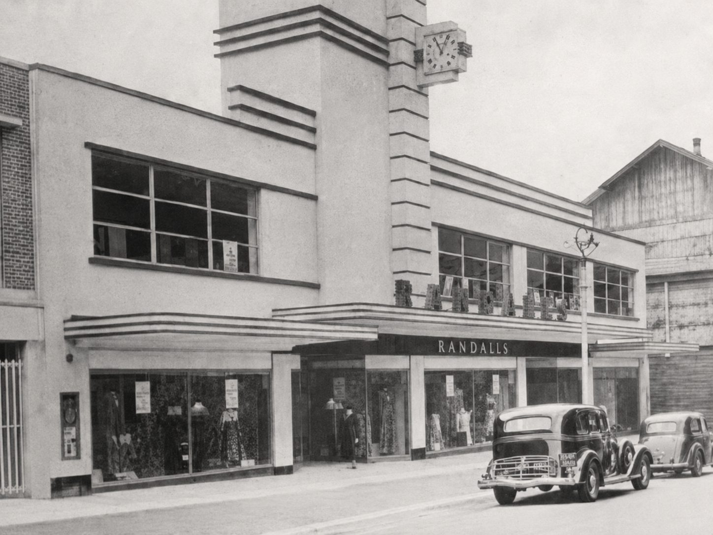 An illustrative view of Randall's original Art Deco department store frontage on Vine Street, showing its 1938 stepped clock tower and shopfront