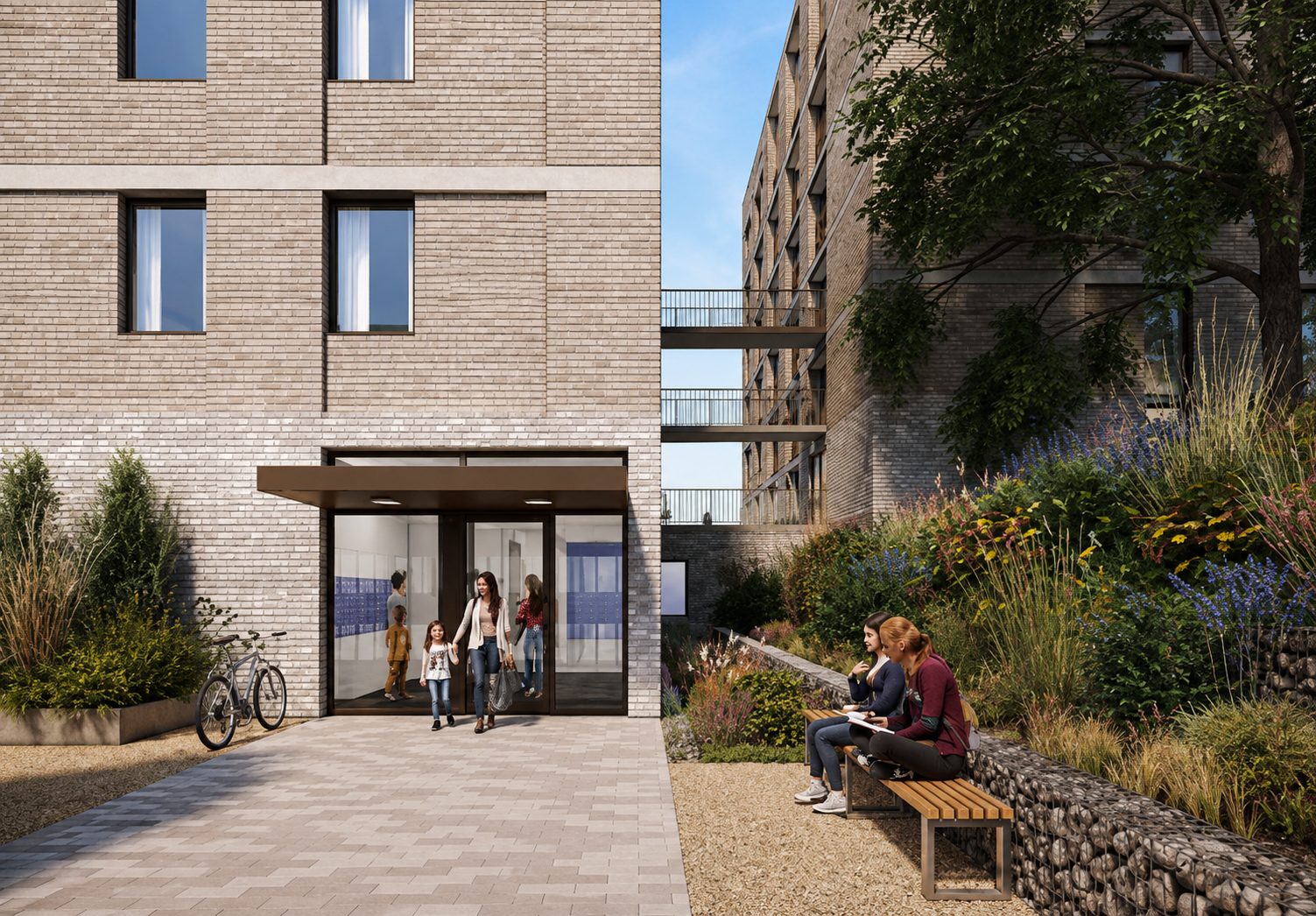 Families entering one of Rye Hill Park's new blocks through its ground-floor entrance canopy