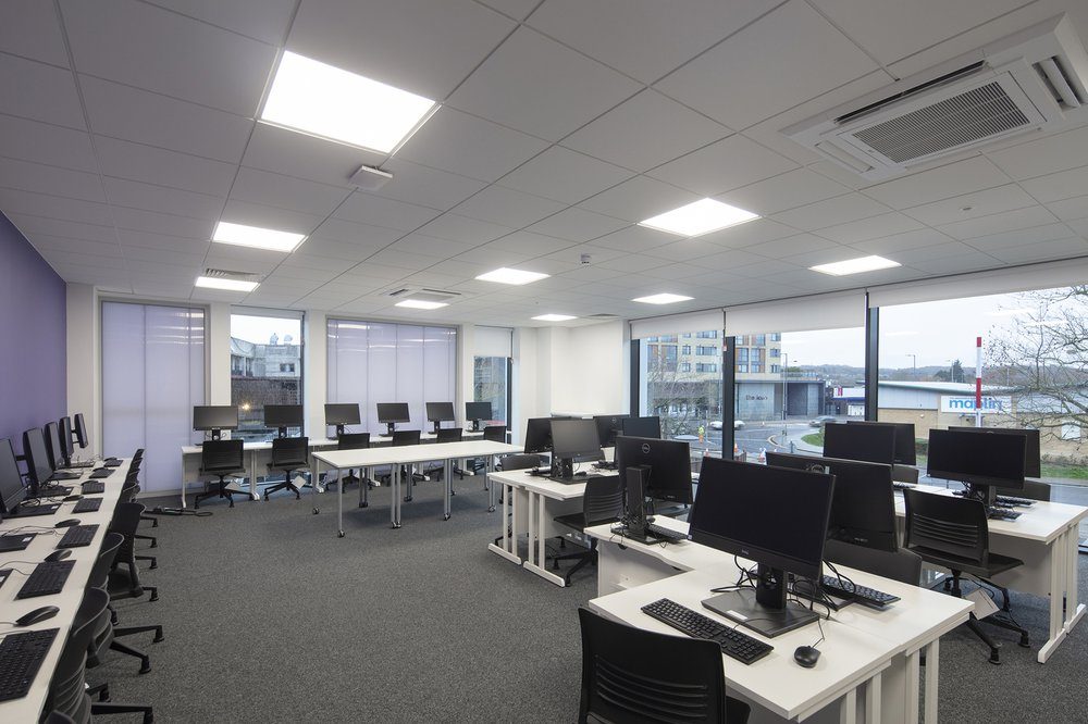 A computer classroom inside the Centre for Digital Technologies, rows of desks and monitors set up for IT and networking teaching